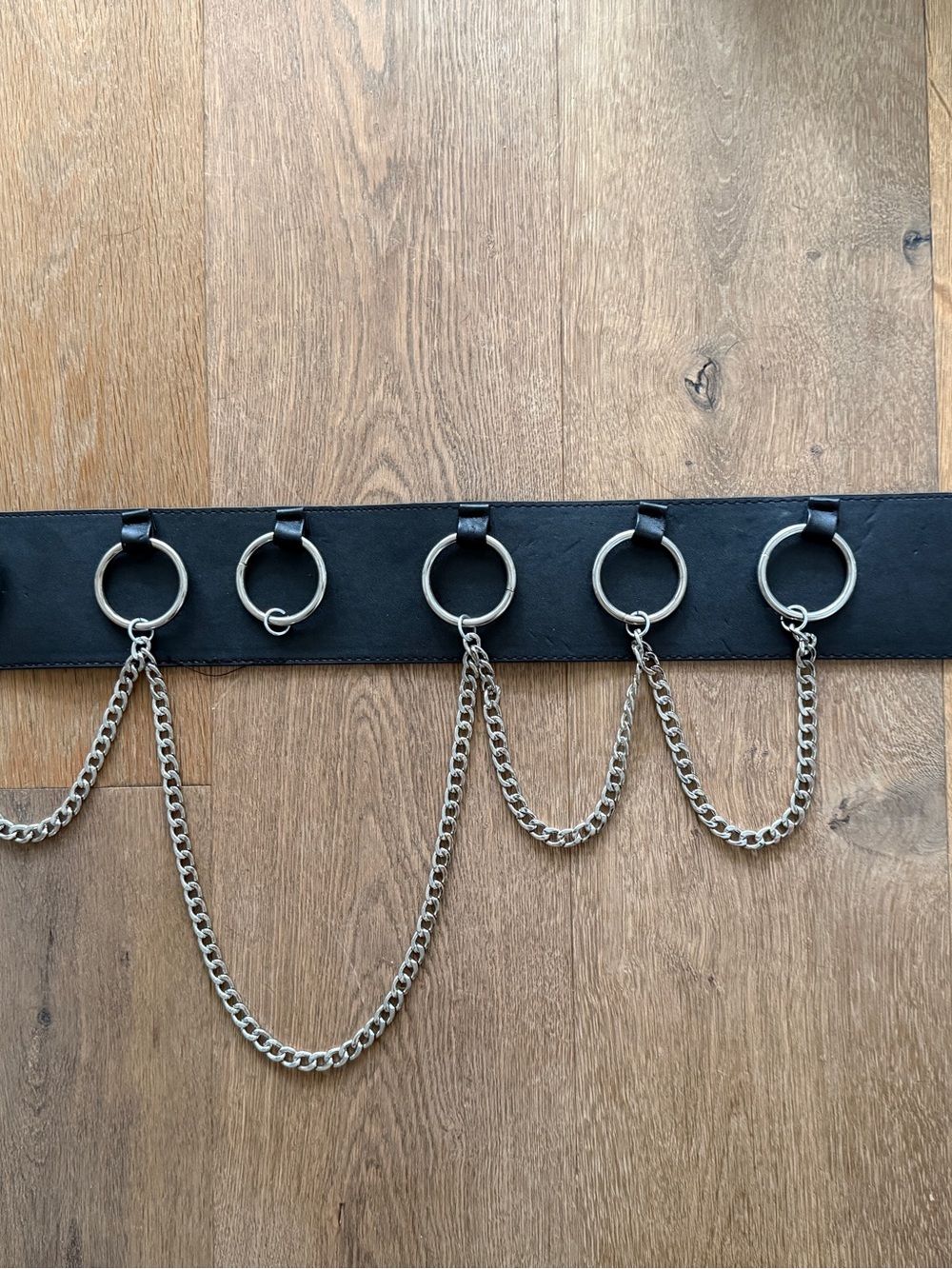 Gothic hardcore tough looking faux leather belt with hardware.